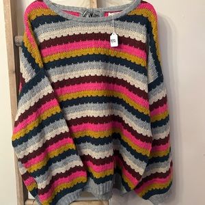 Colorful striped sweater with bow on back